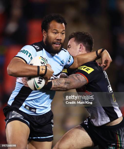 Joseph Paulo of the Sharks is tackled during the round 18 NRL match between the Panthers and the Sharks at Panthers Stadium on July 13, 2018 in...
