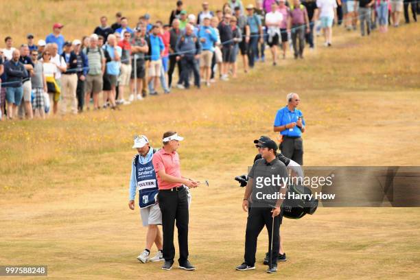 Patrick Reed of USA and Ian Poulter of England talk on the fairway of hole six during day two of the Aberdeen Standard Investments Scottish Open at...