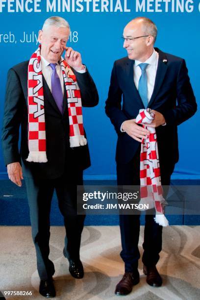 Secretary of Defense James Mattis has a Croatian football scarf given to him by Croatian Minister of Defense Damir Krsticevic during the Special US...