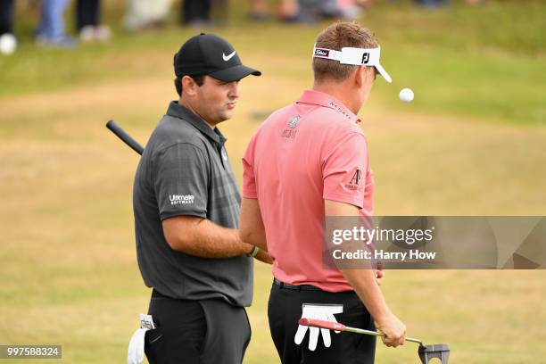 Patrick Reed of USA and Ian Poulter of England talk on the green of hole six during day two of the Aberdeen Standard Investments Scottish Open at...