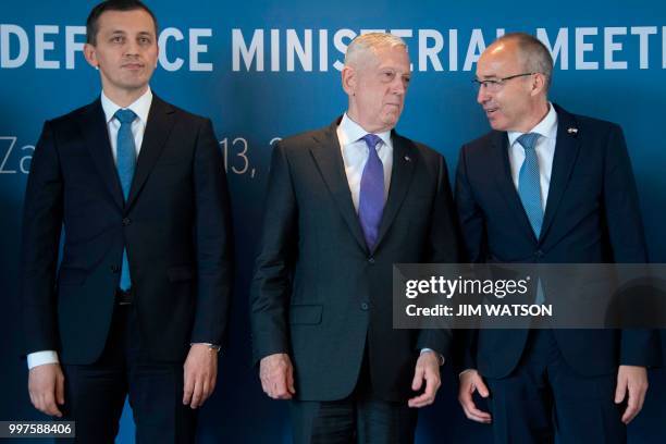 Secretary of Defense James Mattis speaks with Croatian Minister of Defense Damir Krsticevic and Montenegro Minister of Defense Predrag Boskovic...