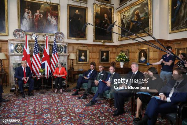 President Donald Trump left, and Theresa May, U.K. Prime minister, second left, sit at the start of their bilateral meeting at Chequers in Aylesbury,...