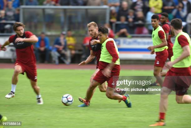 Roberto Firmino and Ragnar Klavan in action at the training camp of British Premier League club FC Liverpool in Rottach-Egern, Germany, 28 July 2017....
