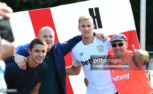 West Ham's goalkeeper Joe Hart poses with fans at the soccer test match between Werder Bremen and West Ham United in Schneverdingen, Germany, 28 July...