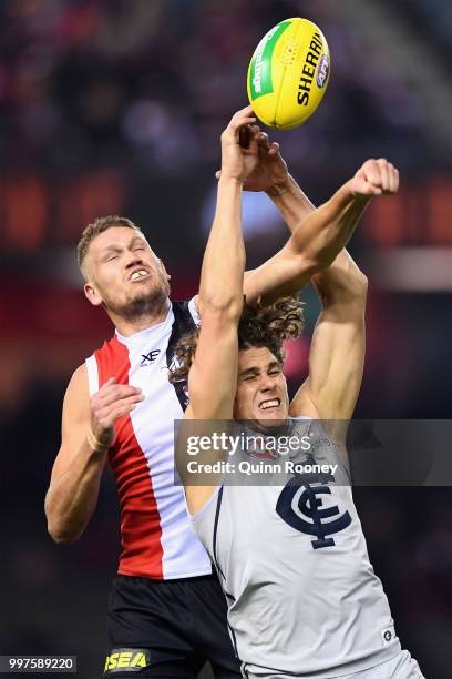 Sam Gilbert of the Saints spoils a mark by Charlie Curnow of the Blues during the round 17 AFL match between the St Kilda Saints and the Carlton...