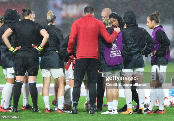 Germany's manager Steffi Jones talks with players ahead of the women's European Championship quarter final soccer match between Germany and Denmark...