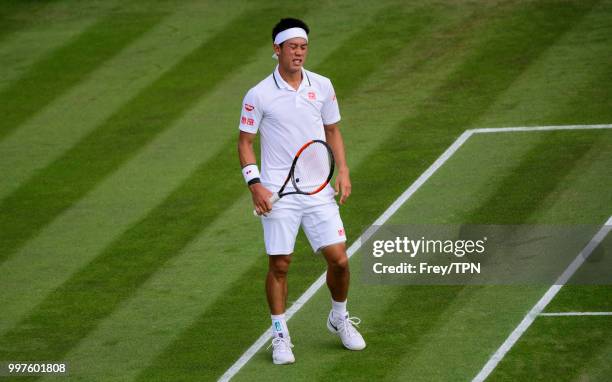 Kei Nishikori of Japan in action against Ernests Gulbis of Latvia in the fourth round of the gentlemen's singles at the All England Lawn Tennis and...