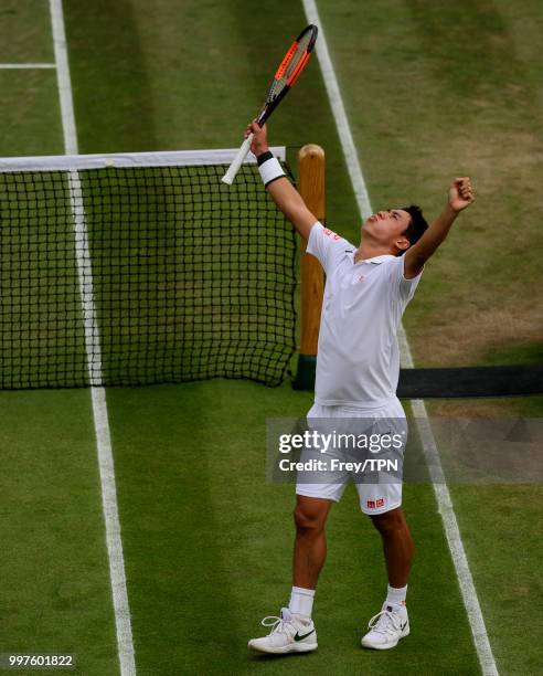 Kei Nishikori of Japan celebrates after beating Ernests Gulbis of Latvia in the fourth round of the gentlemen's singles at the All England Lawn...