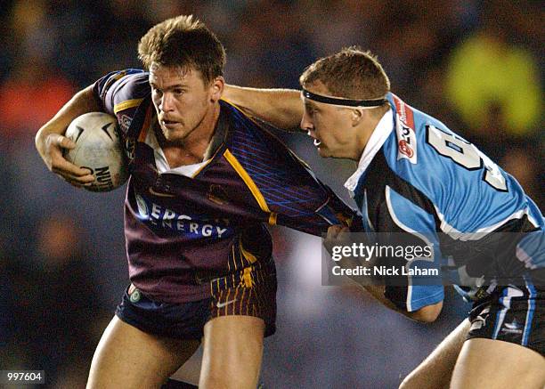 Jason Ferris of the Sharks tackles Shaun Berrigan of the Broncos during the NRL qualifying final between the Sharks and the Brisbane Broncos held at...