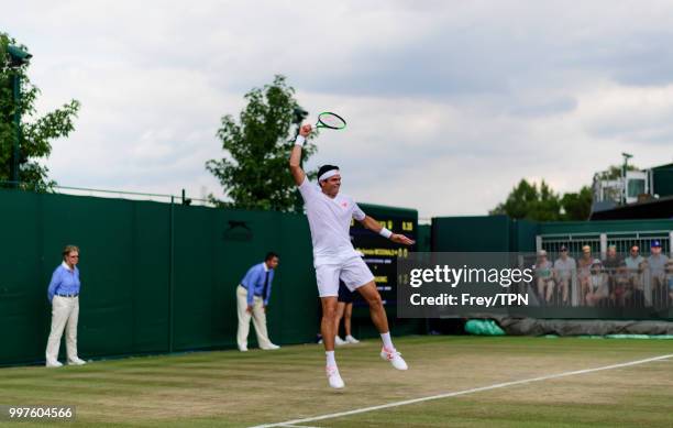 Milos Raonic of Canada in action against Mackenzie McDonald of the United States in the fourth round of the gentlemen's singles at the All England...