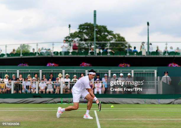 Milos Raonic of Canada in action against Mackenzie McDonald of the United States in the fourth round of the gentlemen's singles at the All England...