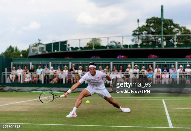 Milos Raonic of Canada in action against Mackenzie McDonald of the United States in the fourth round of the gentlemen's singles at the All England...