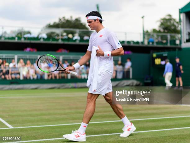 Milos Raonic of Canada in action against Mackenzie McDonald of the United States in the fourth round of the gentlemen's singles at the All England...