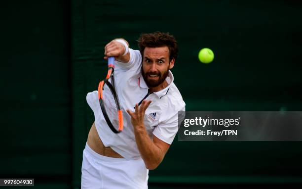 Ernests Gulbis of Latvia in action against Kei Nishikori of Japan in the fourth round of the gentlemen's singles at the All England Lawn Tennis and...