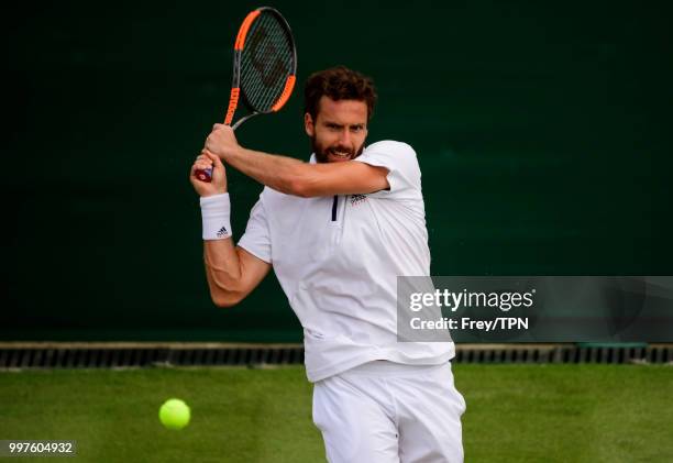 Ernests Gulbis of Latvia in action against Kei Nishikori of Japan in the fourth round of the gentlemen's singles at the All England Lawn Tennis and...