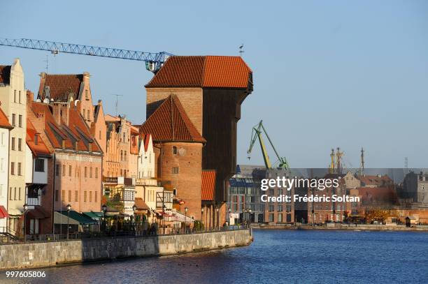 The medieval crane of Gdansk. The medieval harbour crane highest of Europe located at the edge of the Motlawa river in the old city of Gdansk on...