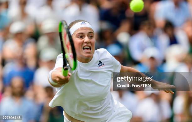 Jelena Ostapenko of Latvia in action against Aliaksandra Sasnovich of Belarus in the fourth round of the ladies' singles at the All England Lawn...