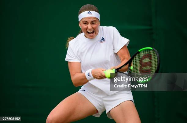 Jelena Ostapenko of Latvia in action against Aliaksandra Sasnovich of Belarus in the fourth round of the ladies' singles at the All England Lawn...