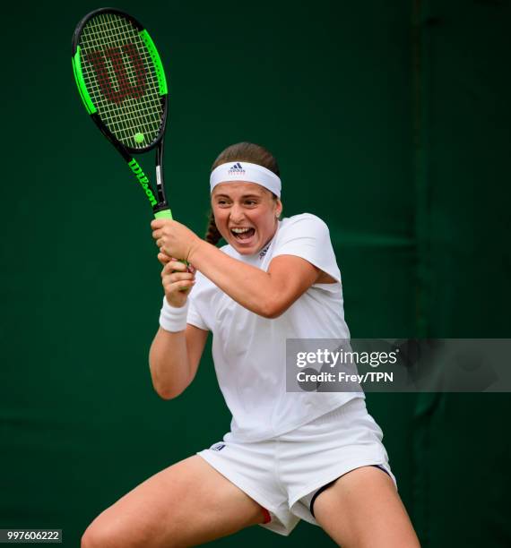 Jelena Ostapenko of Latvia in action against Aliaksandra Sasnovich of Belarus in the fourth round of the ladies' singles at the All England Lawn...