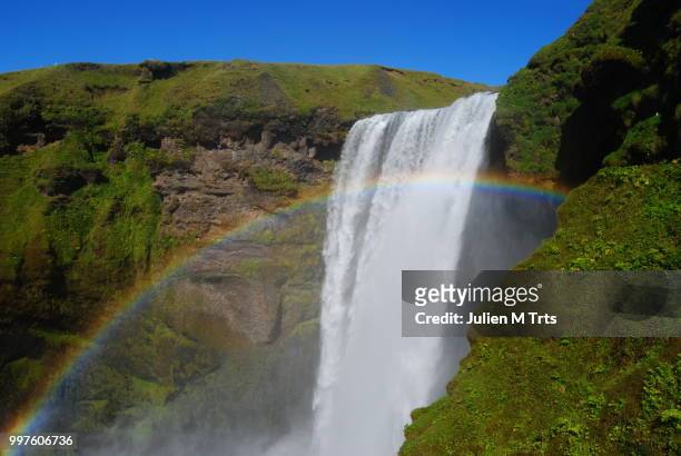 waterfall & rainbow - iceland - rainbow waterfall stock pictures, royalty-free photos & images