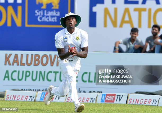 South Africa's Kagiso Rabada takes a catch to dismiss Sri Lanka's Danushka Gunathilaka during the second day of the opening Test match between Sri...