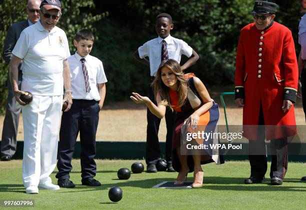 First Lady Melania Trump plays bowls she meets British military veterans known as "Chelsea Pensioners" at Royal Hospital Chelsea on July 13, 2018 in...