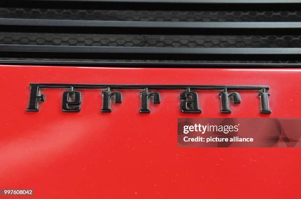 The lettering 'Ferrari' seen on a Ferrari Testarossa from 1988 in the Auto & Technik Museum in Sinsheim, Germany, 29 July 2017. A toy manufacturer is...