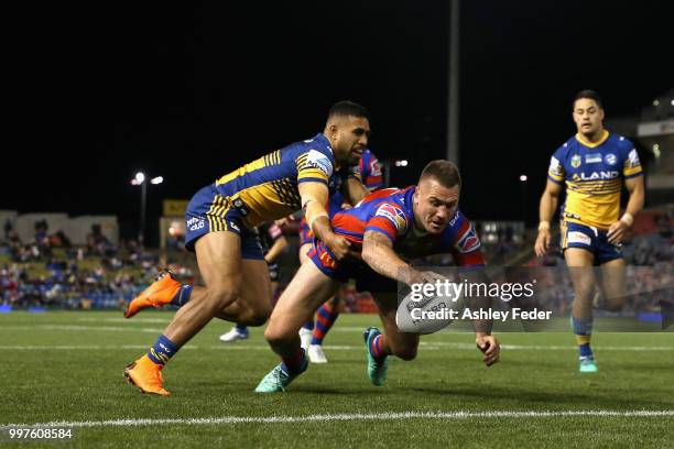 Shaun Kenny-Dowall of the Knights scores a try during the round 18 NRL match between the Newcastle Knights and the Parramatta Eels at McDonald Jones...