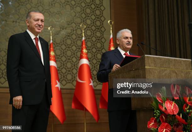 Turkish Grand National Assembly Speaker Binali Yildirim makes a speech as he presents Turkish Prime Ministry's seal to Turkish President Recep Tayyip...