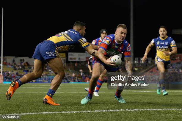 Shaun Kenny-Dowall of the Knights scores a try during the round 18 NRL match between the Newcastle Knights and the Parramatta Eels at McDonald Jones...