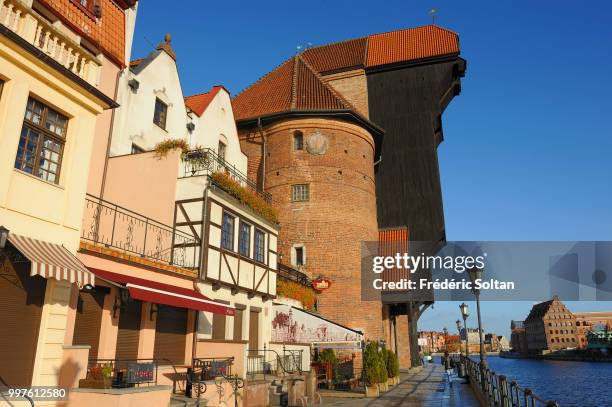 The medieval crane of Gdansk. The medieval harbour crane highest of Europe located at the edge of the Motlawa river in the old city of Gdansk on...