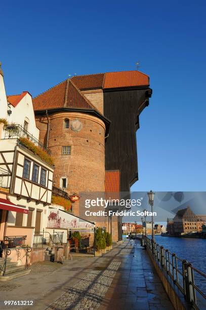 The medieval crane of Gdansk. The medieval harbour crane highest of Europe located at the edge of the Motlawa river in the old city of Gdansk on...