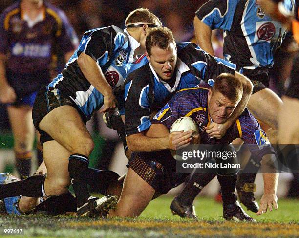 Shane Webcke of the Broncos is wrapped up by the Sharks defence during the NRL qualifying final between the Sharks and the Brisbane Broncos held at...