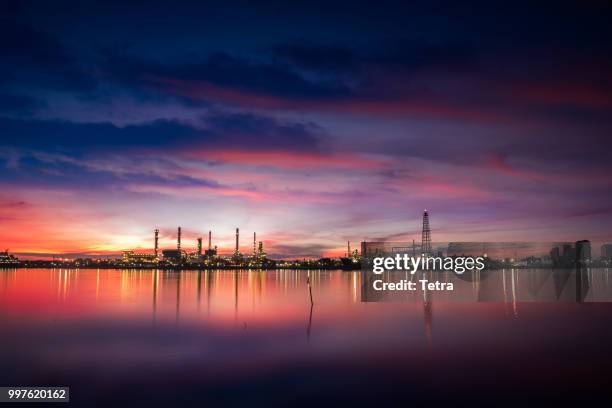 oil and gas industry - refinery at sunrise - factory - petrochem - tetra images stock pictures, royalty-free photos & images