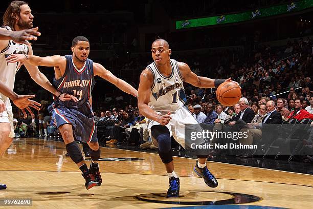 Randy Foye of the Washington Wizards drives the ball against D.J. Augustin of the Charlotte Bobcats during the game on March 23, 2010 at the Verizon...