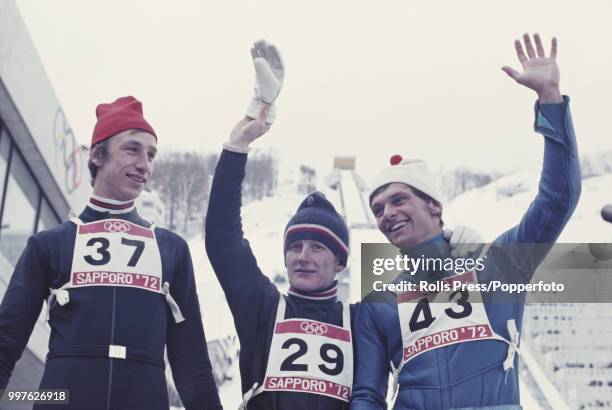 View of the medal winners of the Men's large hill individual ski jumping competition with, from left, silver medallist Walter Steiner of Switzerland,...