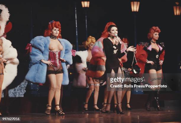 French ballet dancer and performer Zizi Jeanmaire pictured performing on stage with dancers at the Casino de Paris music hall in Paris, France on...
