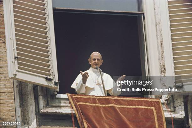 Pope Paul VI blesses the crowds in St Peter's Square in Vatican City from the window of his private study at the Vatican in Rome, Italy on 4th May...