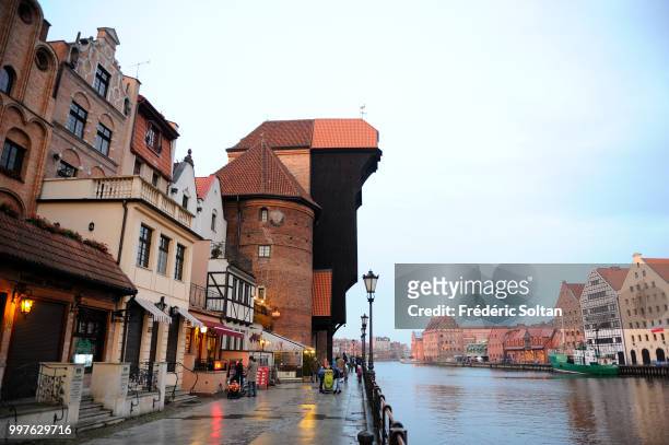 The medieval crane of Gdansk. The medieval harbour crane highest of Europe located at the edge of the Motlawa river in the old city of Gdansk on...