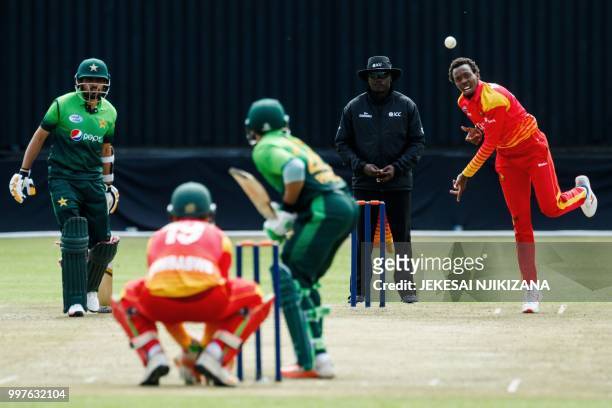 Zimbabwe's bowler Wellington Masakadza delivers the ball during the first one day international cricket match between Pakistan and Zimbabwe at Queens...