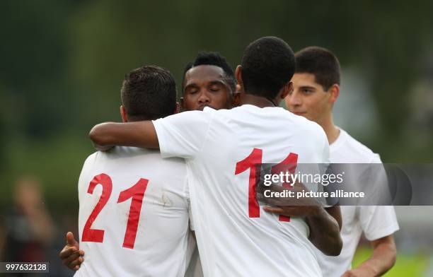 Antalya's Mostapha El Kabir , Antalya's Samuel Eto'o and Antalya's Maicon Marques Bitencourt celebrate after the 1-1 during the test match between...