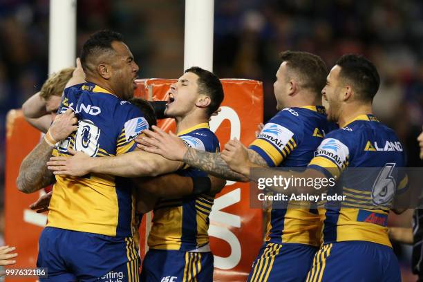 Eels players celebrate a try from Siosaia Vave during the round 18 NRL match between the Newcastle Knights and the Parramatta Eels at McDonald Jones...