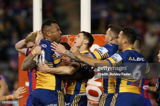 Eels players celebrate a try from Siosaia Vave during the round 18 NRL match between the Newcastle Knights and the Parramatta Eels at McDonald Jones...