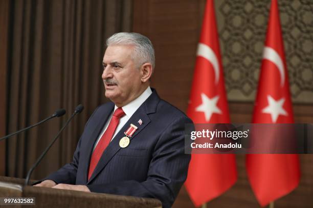 Turkish Grand National Assembly Speaker Binali Yildirim makes after he received the certificate for Order of Merit for his outstanding service to...