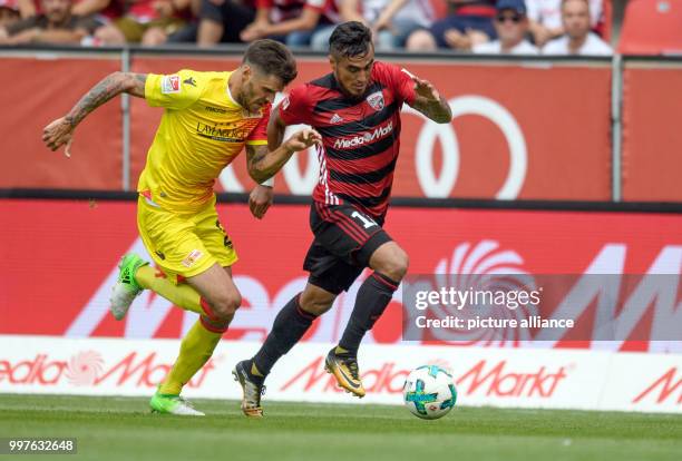 Union Berlin's Christopher Trimmel and FC Ingolstadt's Dario Lezcano vie for the ball during the German 2. Bundesligar soccer match between FC...