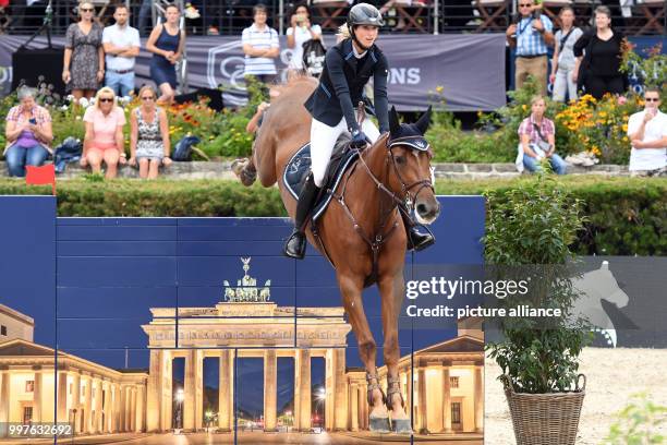 Simone Blum on horse DSP Alice takes part in the qualification for the Grand Prix of Berlin during the jumping test at the Global Champions Tour,...