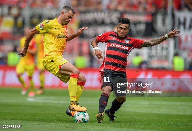 Union Berlin's Marc Torrejon and FC Ingolstadt's Dario Lezcano vie for the ball during the German 2. Bundesligar soccer match between FC Ingolstadt...