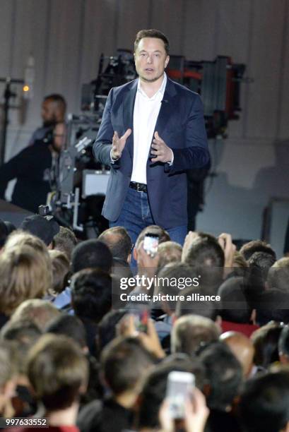 Tesla-CEO Elon Musk speaks in front of employees during the delivery of the first more reasonable Tesla vehicle Model 3 on the company grounds in...