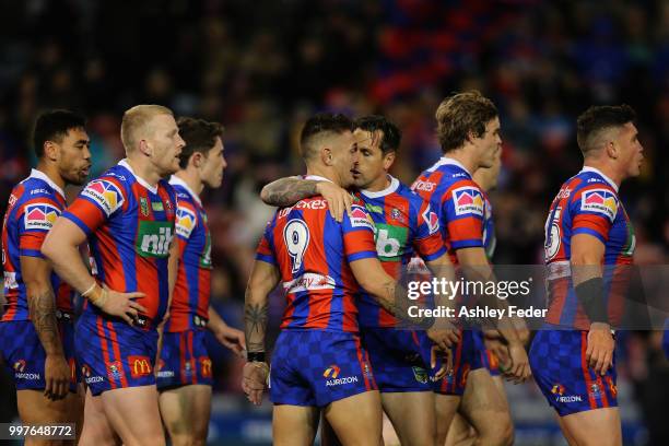 Mitchell Pearce of the Knights celebrates his try with team mates during the round 18 NRL match between the Newcastle Knights and the Parramatta Eels...