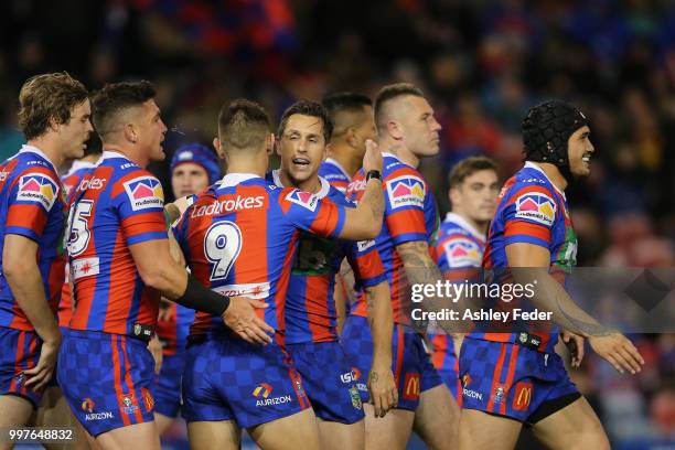 Mitchell Pearce of the Knights celebrates his try with team mates during the round 18 NRL match between the Newcastle Knights and the Parramatta Eels...